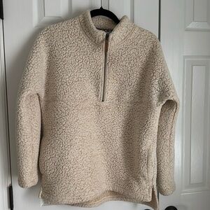 Girls cream colored quarter zipped jacket in size 8-10. Very good condition.